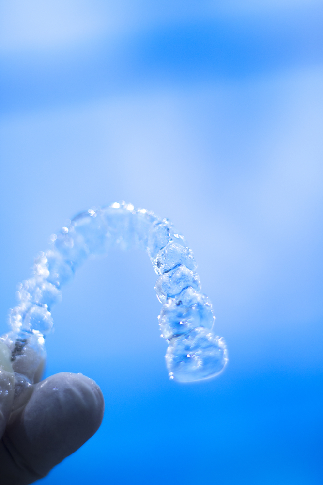Invisible retainers dental straightener and aligner brackets used to straighten and align teeth in cosmetic dentistry.